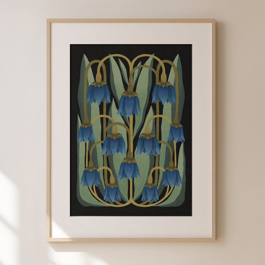 Framed artwork of bluebell flowers on a beige wall